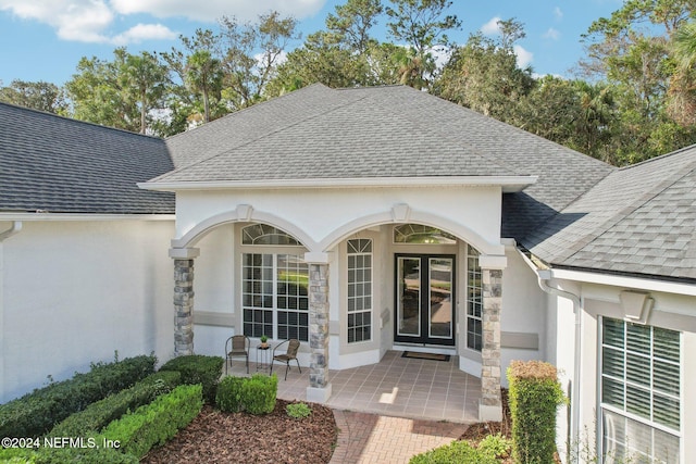 entrance to property with a patio