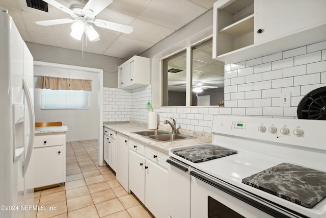 kitchen featuring decorative backsplash, white cabinetry, white appliances, and sink