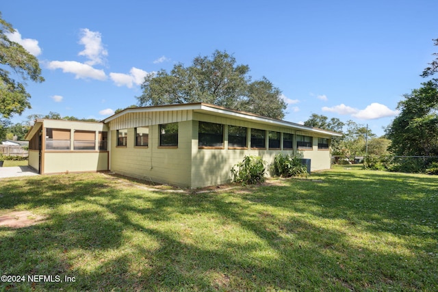 exterior space featuring a front lawn