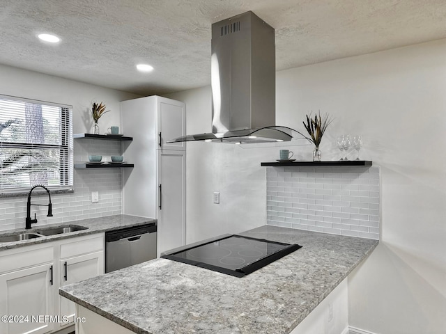 kitchen featuring island exhaust hood, tasteful backsplash, stainless steel dishwasher, sink, and white cabinetry