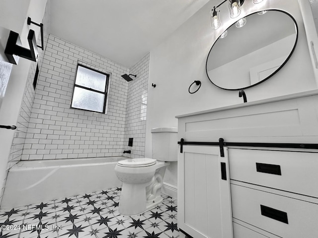 full bathroom with vanity, toilet, and tiled shower / bath