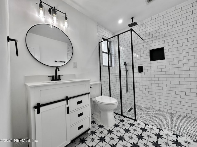 bathroom featuring vanity, toilet, and a shower with door