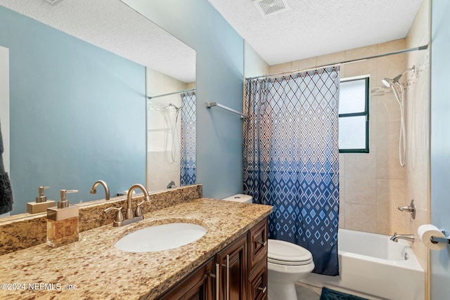 full bathroom featuring a textured ceiling, vanity, toilet, and shower / bath combination with curtain