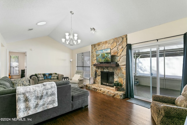 living room with lofted ceiling, a stone fireplace, a wealth of natural light, and dark hardwood / wood-style floors