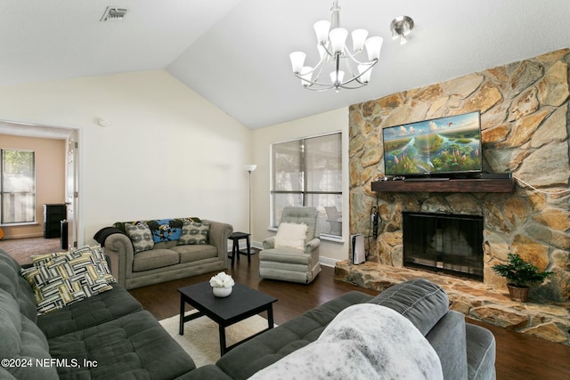 living room featuring dark hardwood / wood-style flooring, an inviting chandelier, a stone fireplace, and lofted ceiling