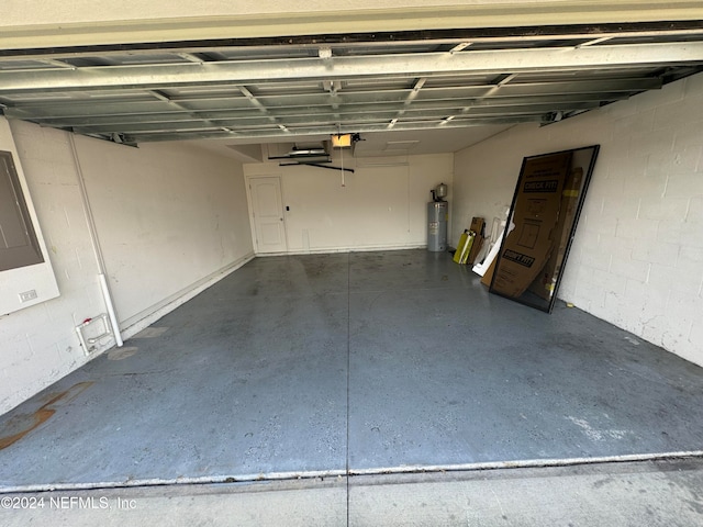 garage with water heater and a garage door opener