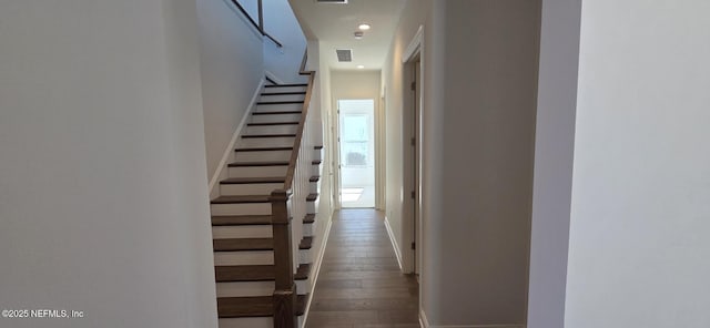 hall with stairway, wood-type flooring, visible vents, and recessed lighting