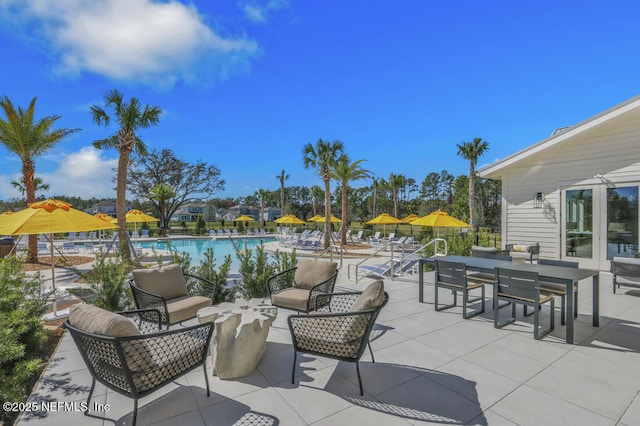 view of patio / terrace featuring a community pool