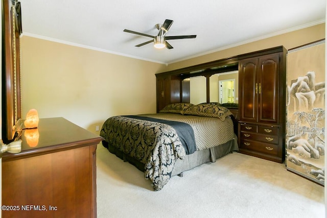 bedroom featuring ceiling fan, ornamental molding, and light carpet