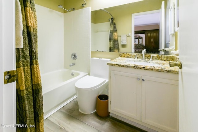 full bathroom featuring vanity, wood-type flooring, shower / bath combo, and toilet