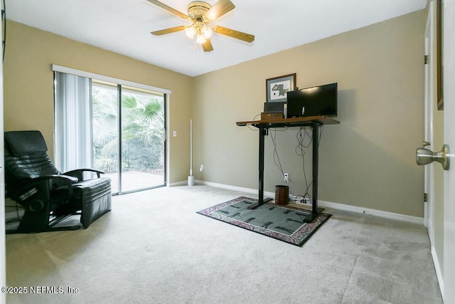 exercise area featuring ceiling fan and light carpet