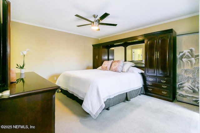 bedroom with ornamental molding, light colored carpet, and a ceiling fan