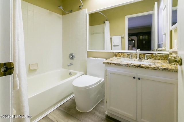 bathroom featuring shower / tub combo, vanity, toilet, and wood finished floors