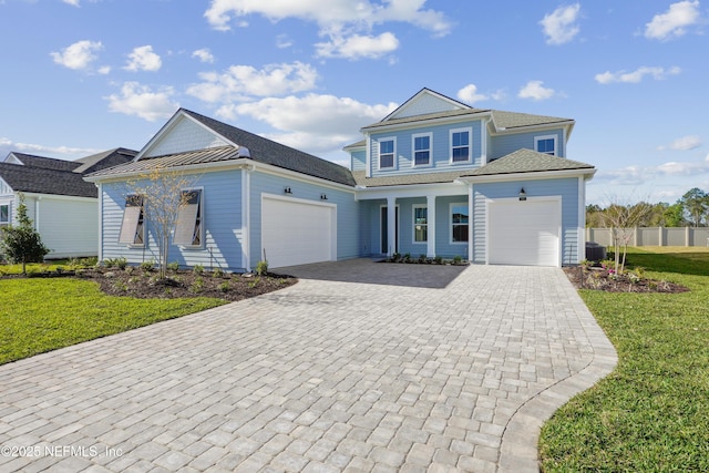 300 Hillendale Cir, Saint Johns, FL 32259 - view of front of house featuring a front yard, decorative driveway, a garage, and fence