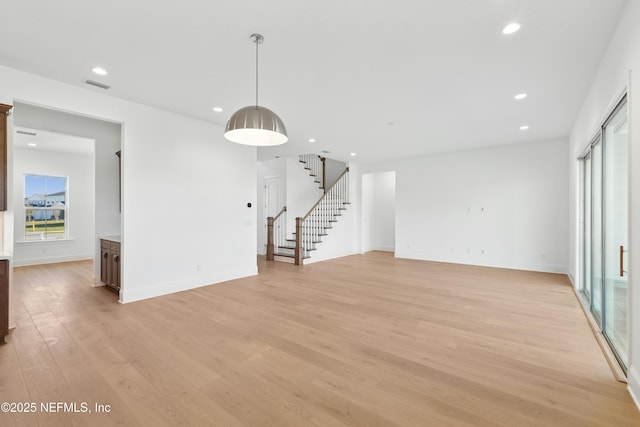 300 Hillendale Cir, Saint Johns, FL 32259 - unfurnished living room featuring visible vents, baseboards, stairs, recessed lighting, and light wood-style floors