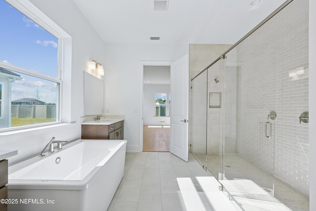 300 Hillendale Cir, Saint Johns, FL 32259 - bathroom featuring a shower stall, visible vents, a soaking tub, and vanity