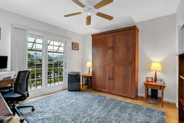 office featuring light wood-type flooring and ceiling fan