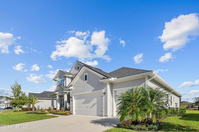 view of front facade featuring a front yard and a garage