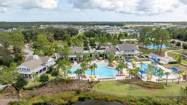 aerial view of residential area featuring a pool