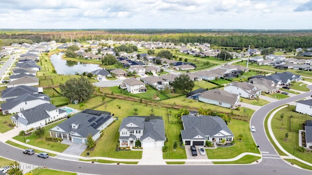view of property location featuring nearby suburban area and a large body of water