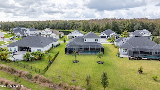 aerial perspective of suburban area with a heavily wooded area