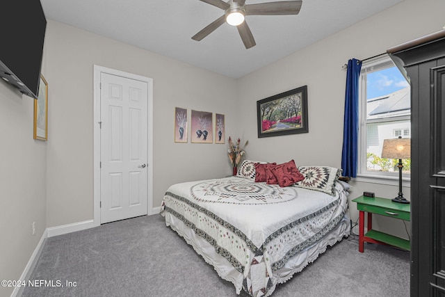 carpeted bedroom with ceiling fan