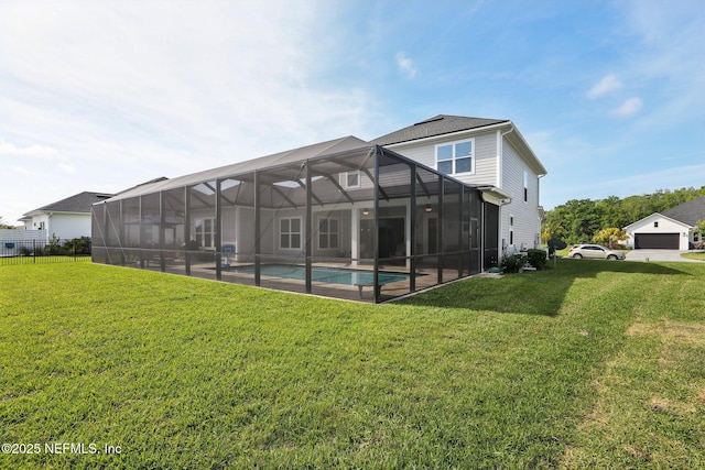rear view of property featuring an outdoor pool and a lanai