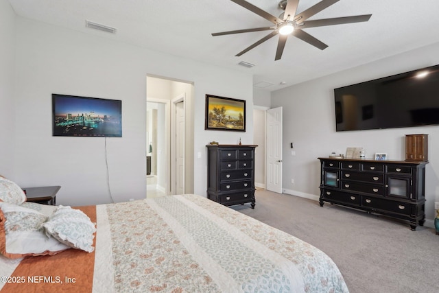 carpeted bedroom featuring baseboards and a ceiling fan
