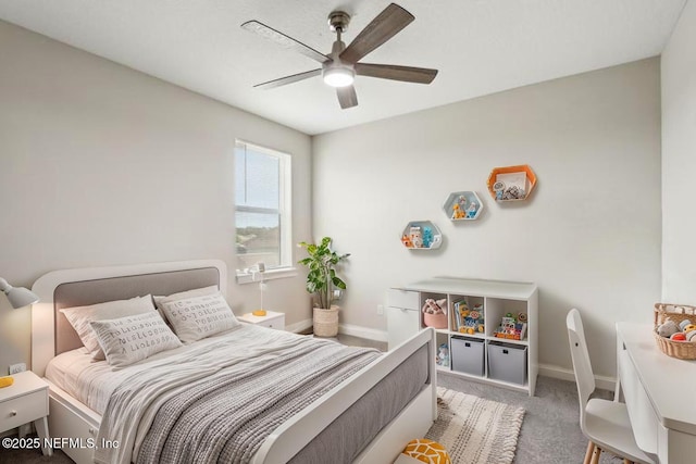 carpeted bedroom with baseboards and a ceiling fan