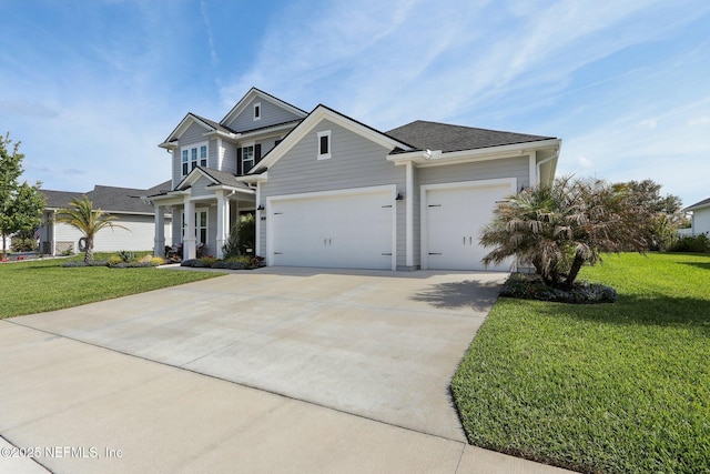 view of front facade featuring driveway, a front yard, and a garage