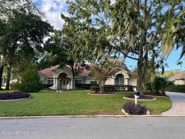 view of front of home with a front lawn