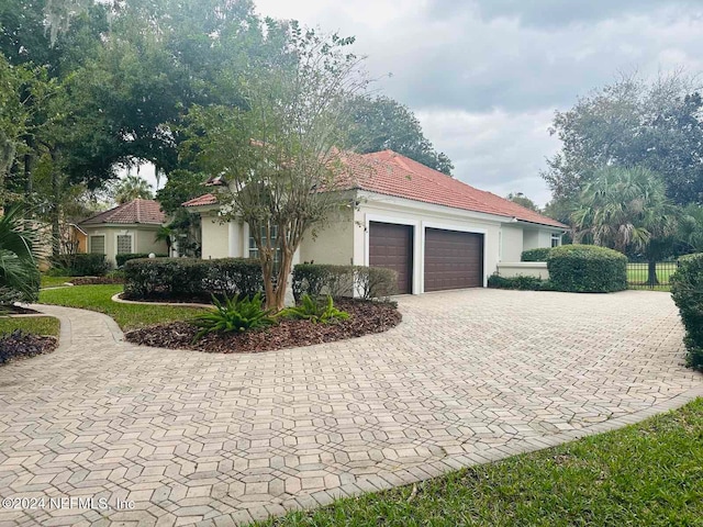 view of side of home with a garage