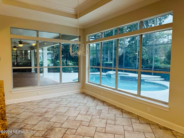 unfurnished sunroom with ceiling fan and a healthy amount of sunlight