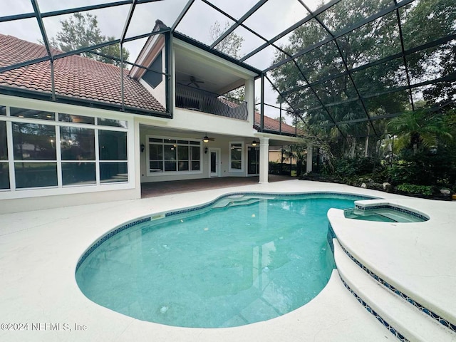 view of pool featuring an in ground hot tub, a patio, ceiling fan, and a lanai