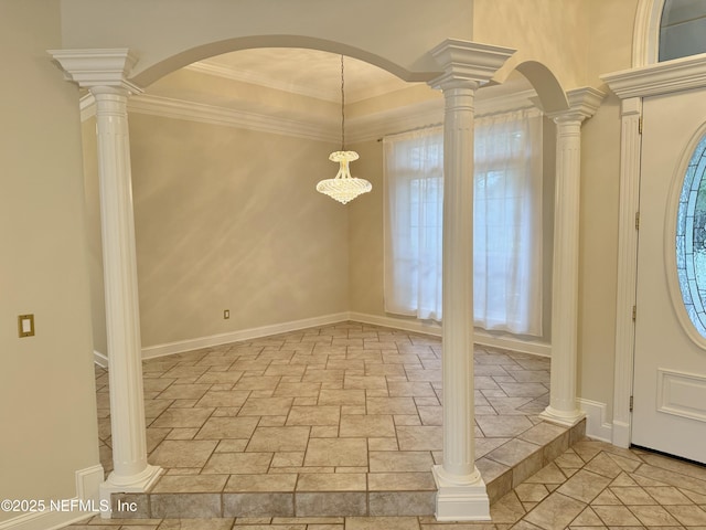 entryway with ornate columns and ornamental molding