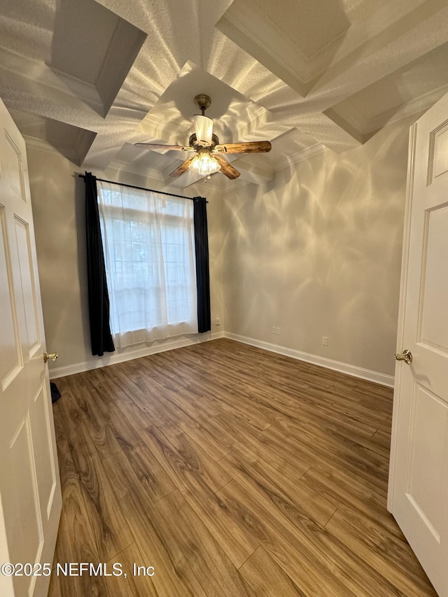 spare room featuring hardwood / wood-style flooring and ceiling fan