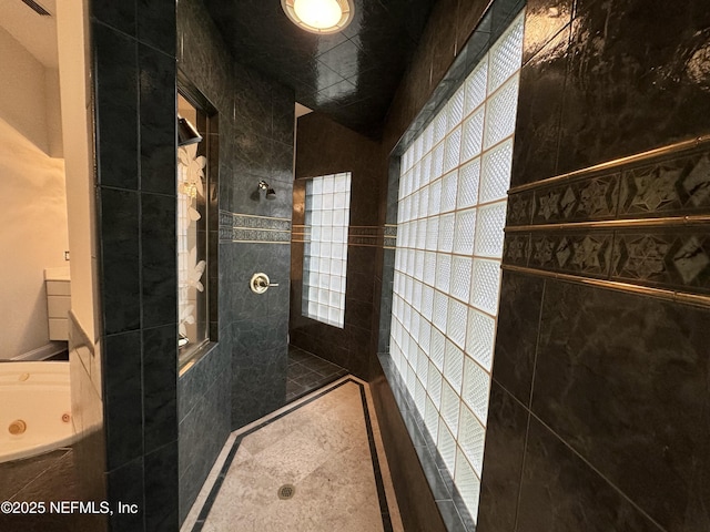 bathroom with a tile shower