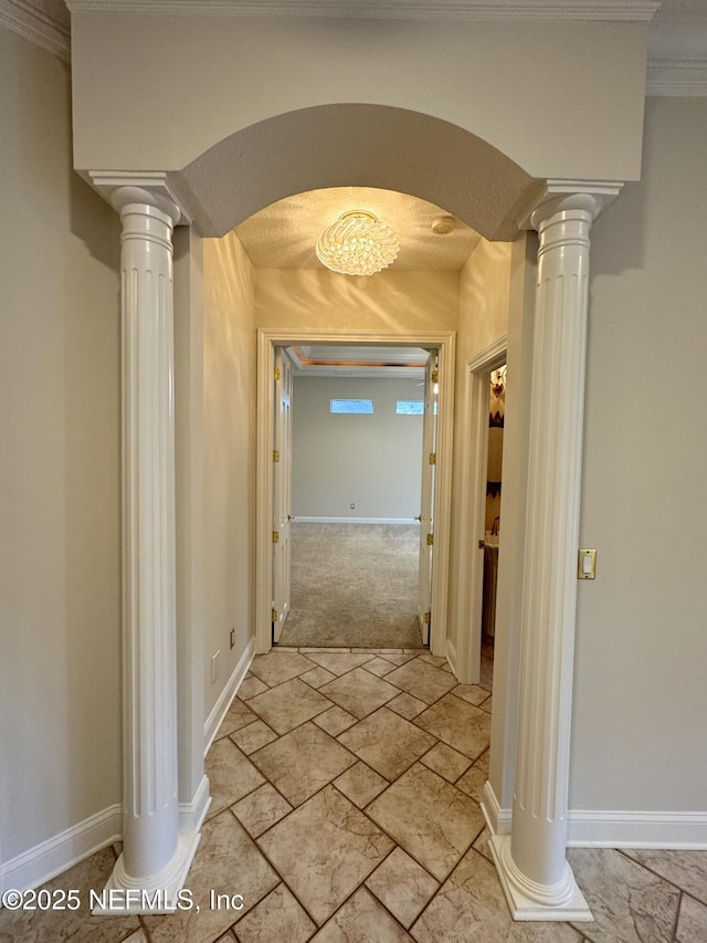 hall featuring ornate columns