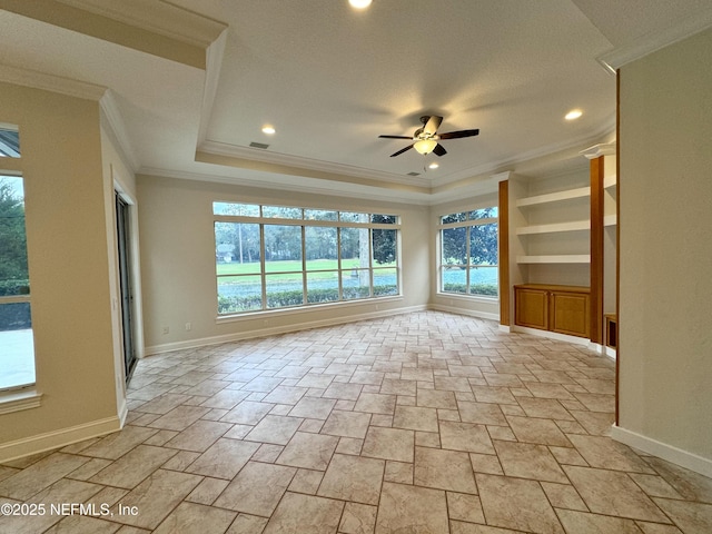 interior space featuring crown molding, built in features, and ceiling fan