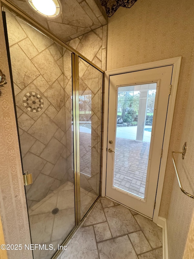 bathroom with a shower with shower door