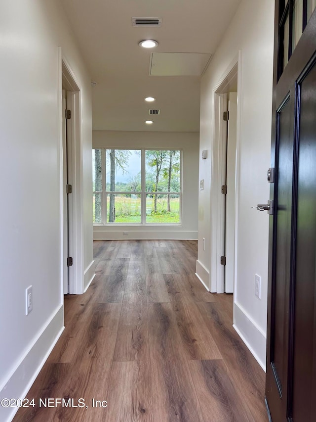 hall with dark wood-type flooring