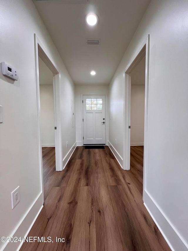 doorway to outside featuring dark hardwood / wood-style flooring