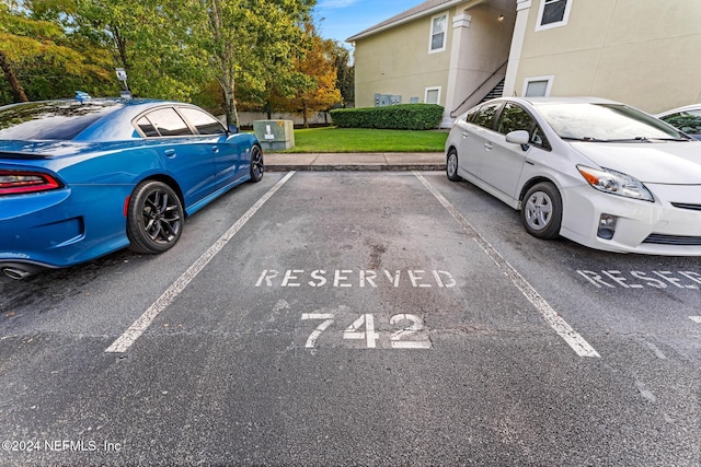 7920 Merrill Rd Unit 1116, Jacksonville, FL 32277 - uncovered parking lot featuring stairway