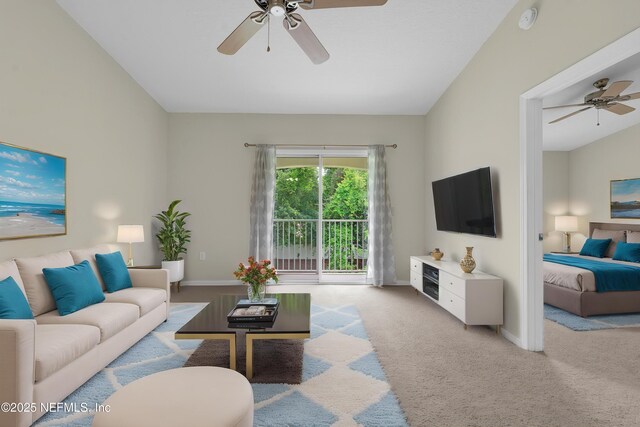 carpeted living area with a ceiling fan and baseboards