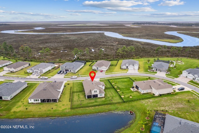 birds eye view of property featuring a water view