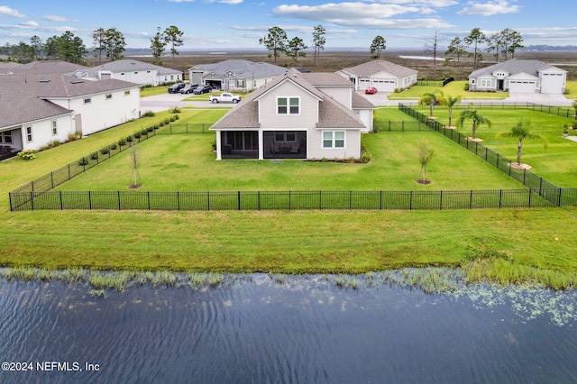 birds eye view of property with a water view