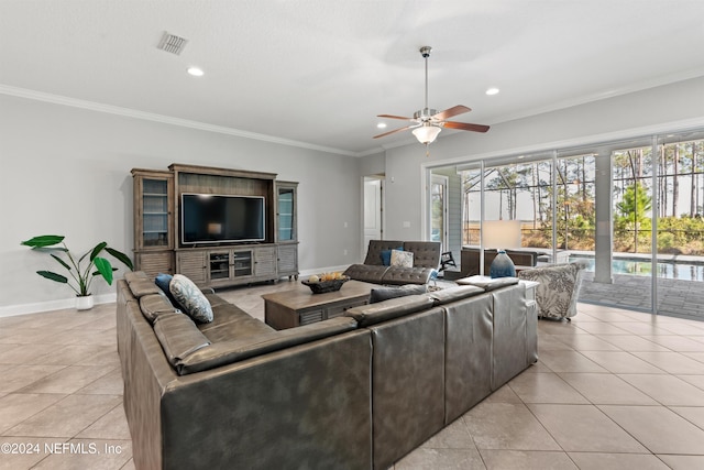 tiled living room with ceiling fan and ornamental molding