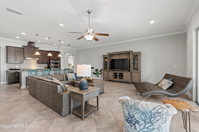 tiled living room featuring ceiling fan and crown molding