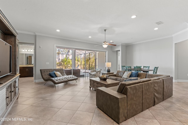 living room featuring crown molding, light tile patterned floors, and ceiling fan