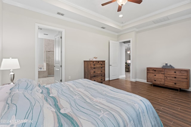 bedroom with hardwood / wood-style floors, connected bathroom, ceiling fan, and ornamental molding